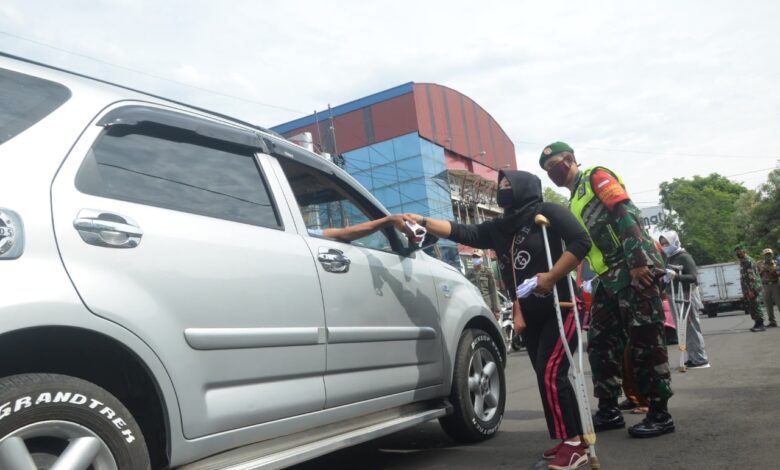 Kodim 0608 Gandeng NPCI Bagikan Ribuan Masker pada Warga